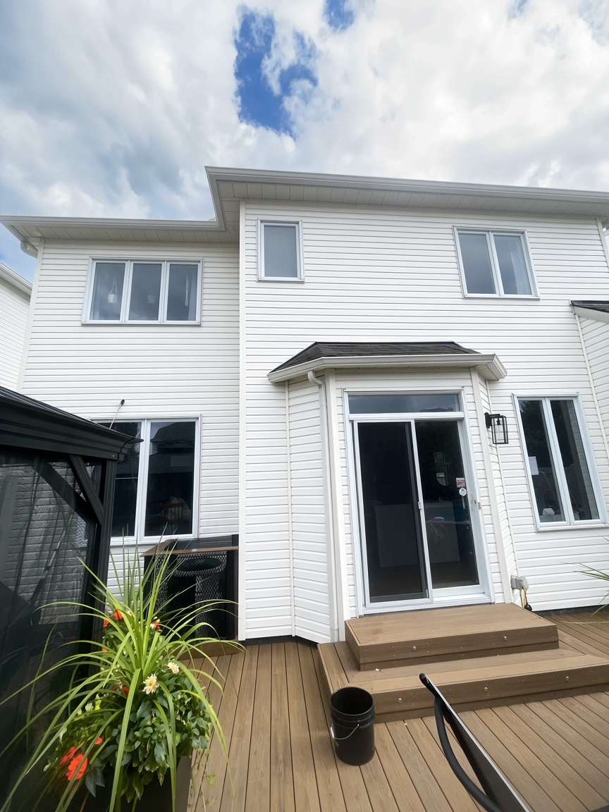 Clean white vinyl siding and exterior facade of a two-story Ottawa home after professional pressure washing
